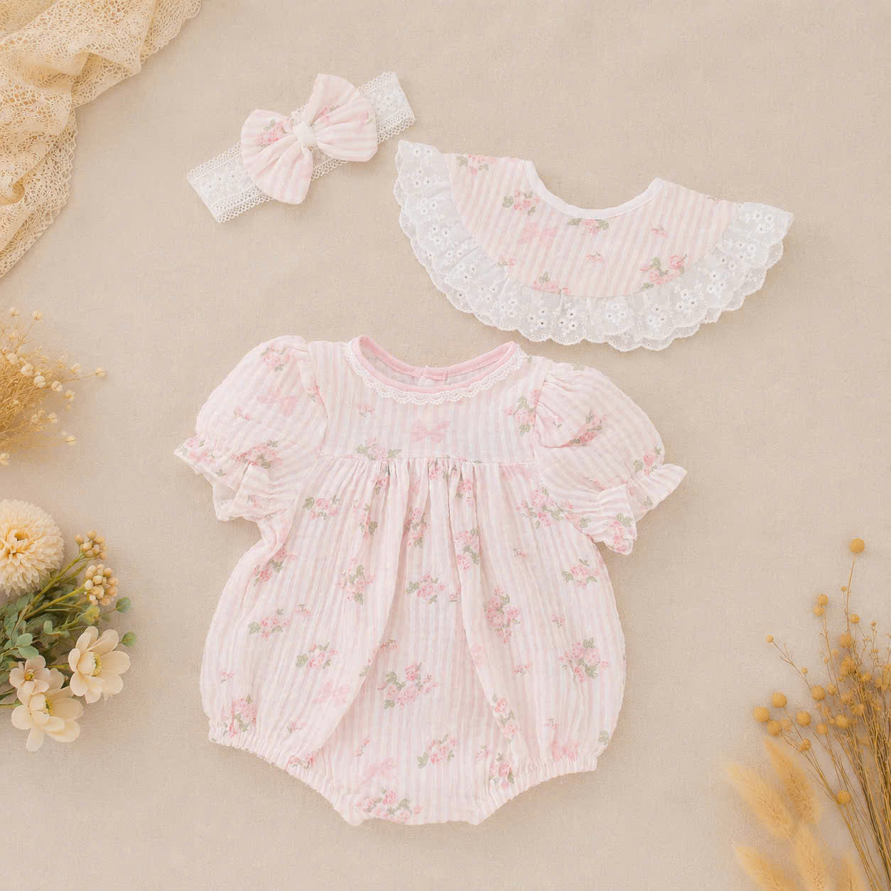 Rosy Whisper Romper Set Newborn–12 Months | Floral Baby Romper with Detachable Lace Bib & Matching Headband