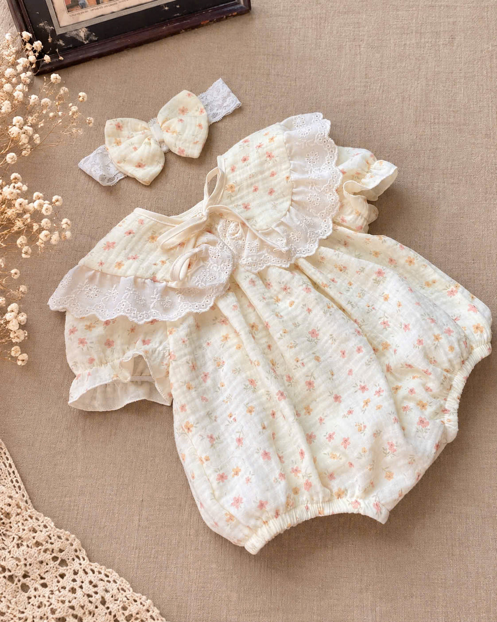 Floral Meadow Muslin Baby Romper Set Newborn–12 Months | Baby Girl Cotton Muslin Romper with Detachable Lace Bib & Matching Bow Headband